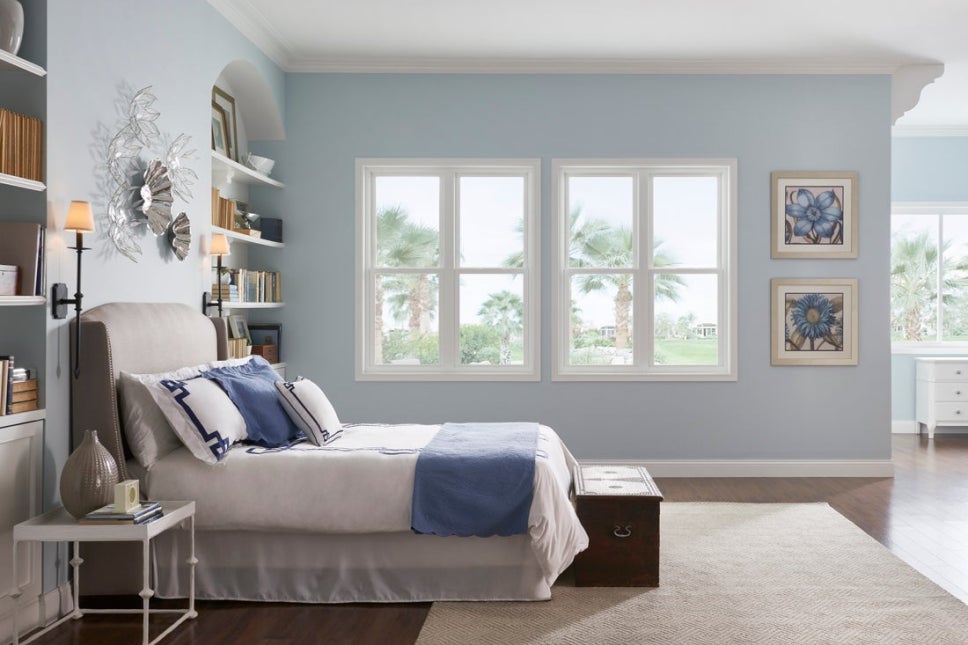 White vinyl windows in a spacious bedroom