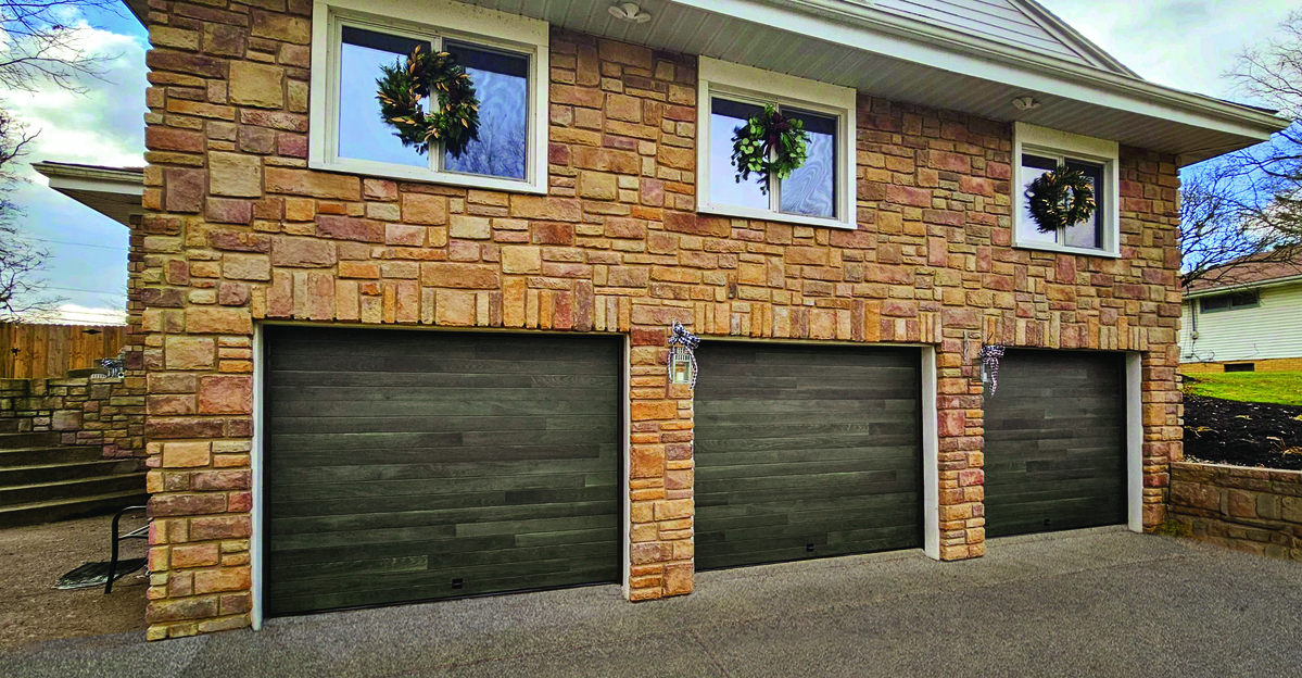 Carbon Oak contemporary residential garage door installed in a suburban family home