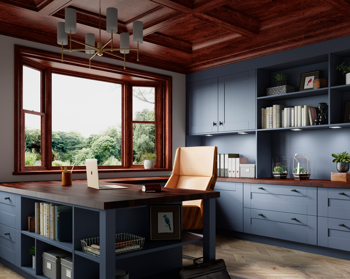 A wood-framed bay window complements the wooden accents throughout an otherwise blue home office.
