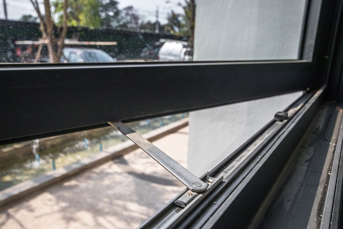 The functional pivot bar of a window’s lower sash.
