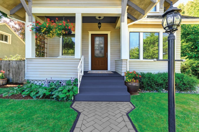 A New-Earth colored Fiber-Classic® Fiberglass Entry Door on a quaint porch