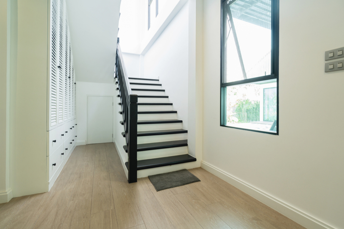 A black and white staircase and black window