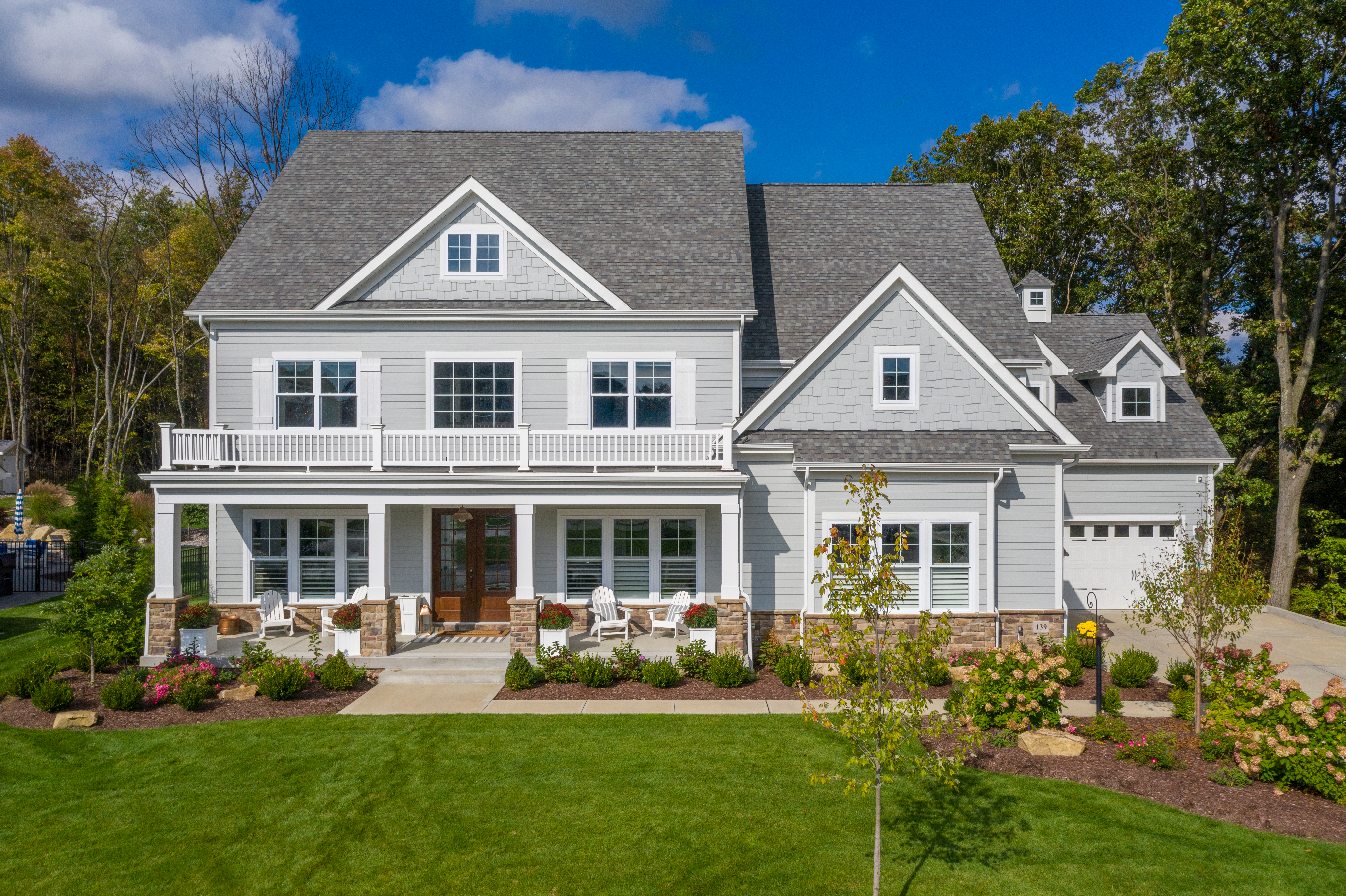 2-story home with hardie plank, shingle and trim in Light Mist