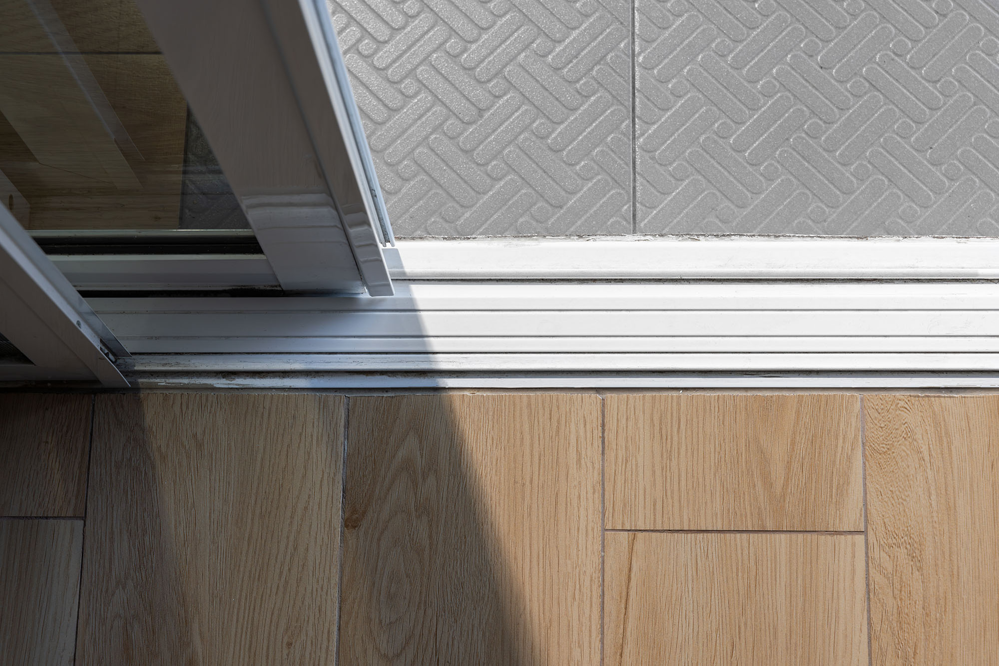 A sliding patio door with a clean track.