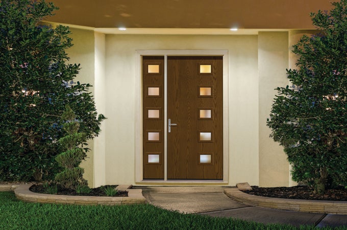 A Barley colored Therma-Tru® Pulse® Modern Entry Door below two recessed lights