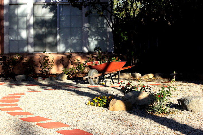 A home using low-maintenance bushes for landscaping A home using low-maintenance bushes for landscaping