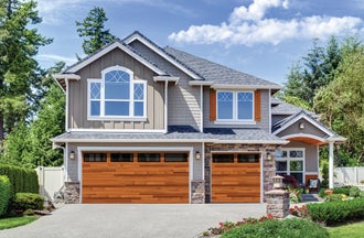 Black contemporary residential garage door with windows, installed in a suburban family home