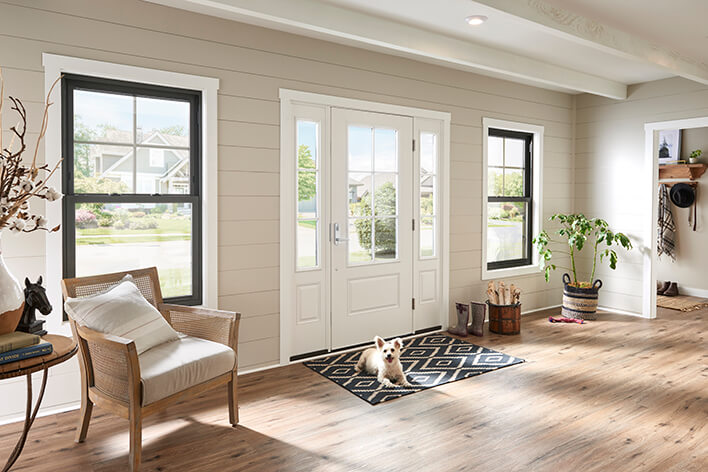 Entryway to a home with large energy-efficient windows