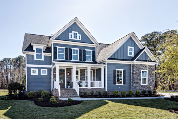 Classic blue exterior house color with dark shutters 