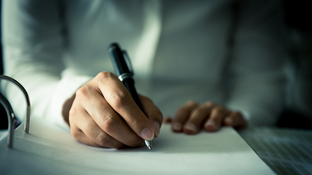 pen in hand writing