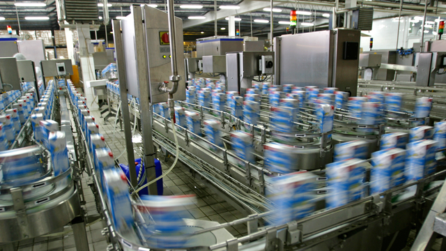 Automated production line in modern dairy factory.