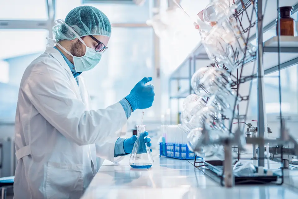 Man works with chemical substances in a labor