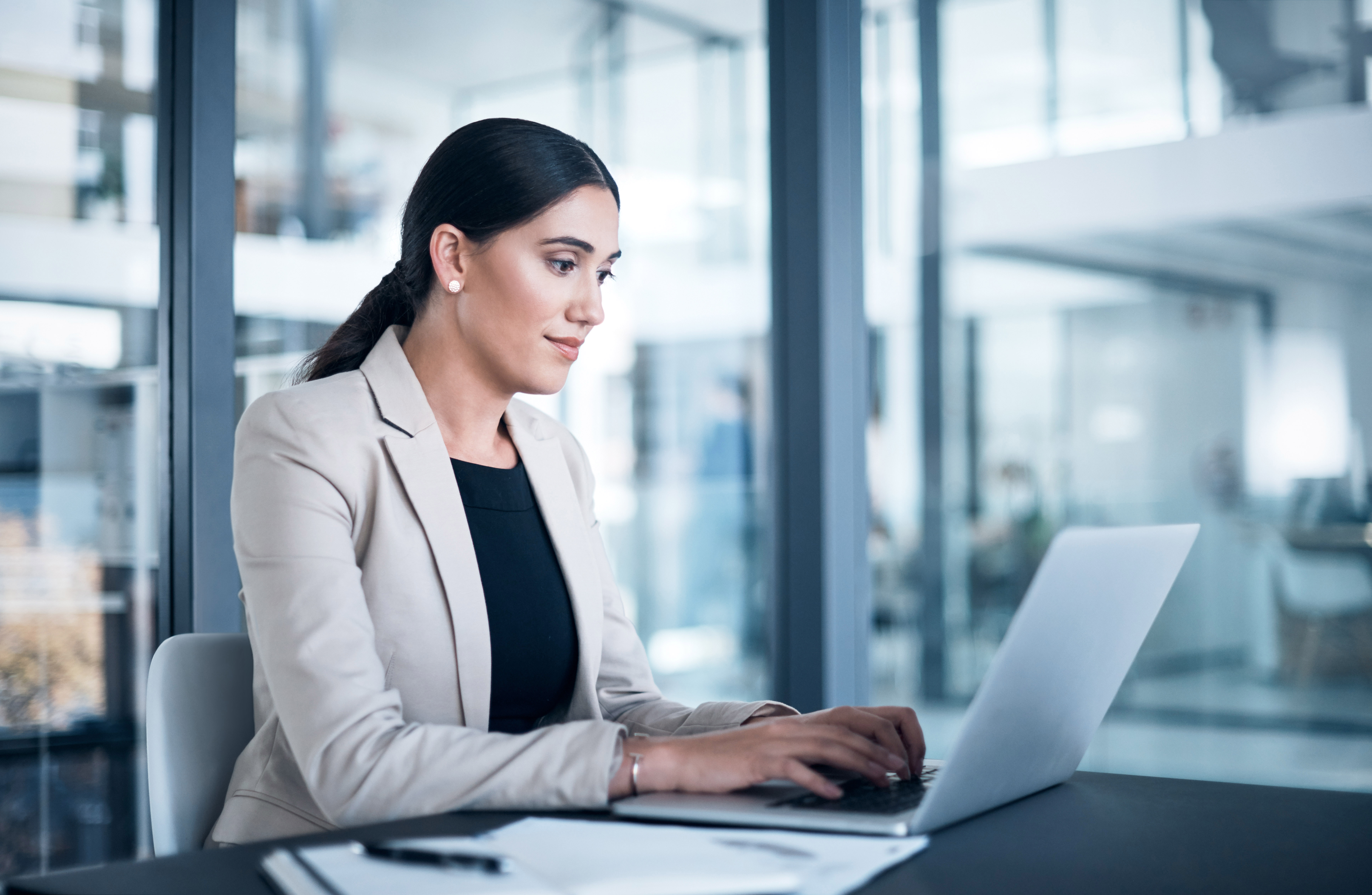 Woman working with a laptop in an office