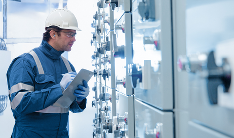 Man checking energy and mining systems