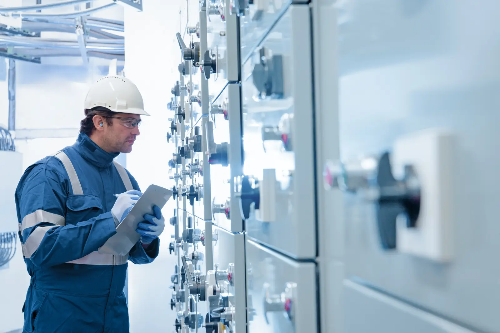 Man checking energy and mining systems