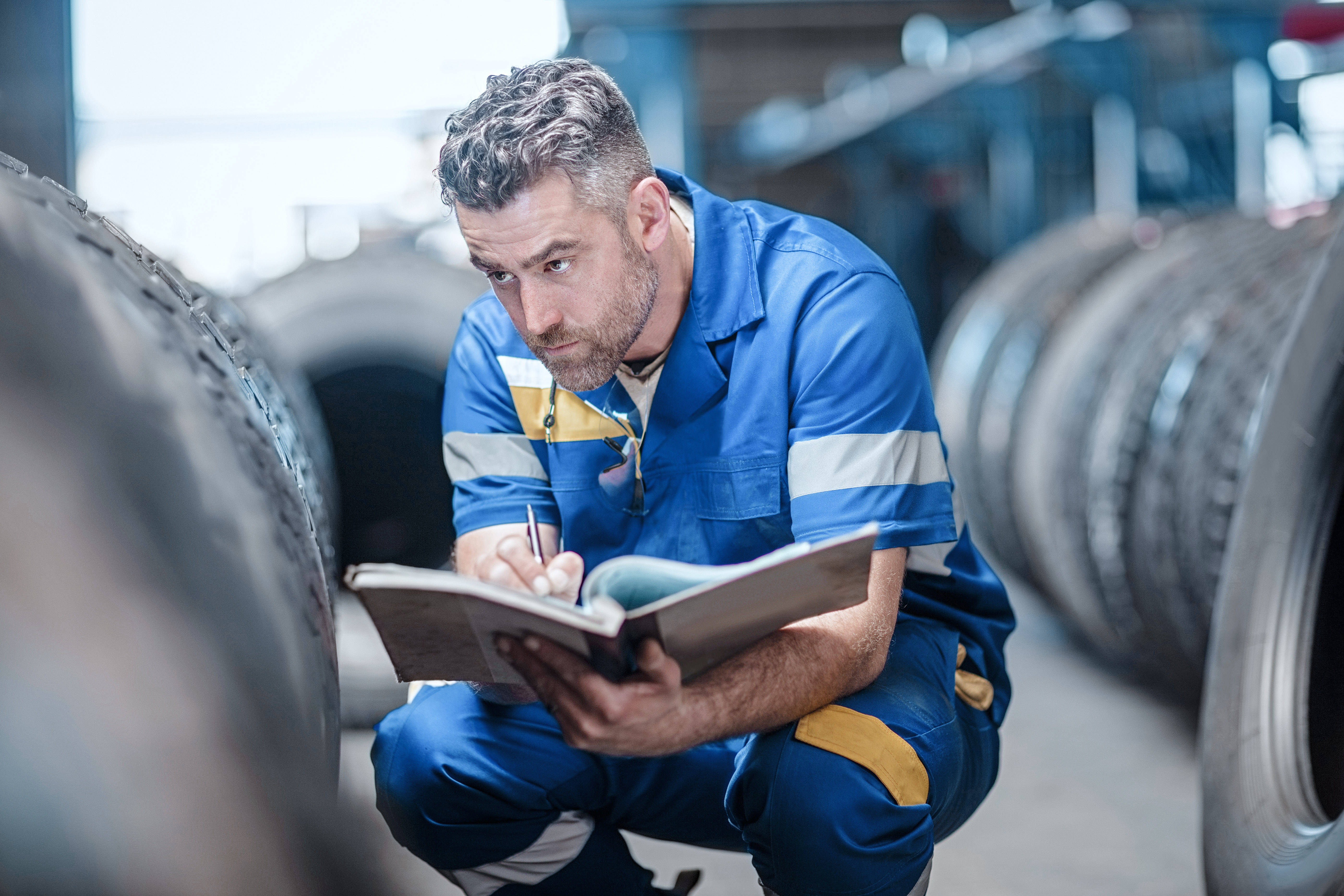 Man who makes notes in the tire store