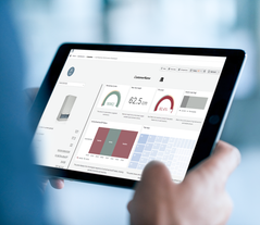 Customer viewing remote support dashboard on tablet