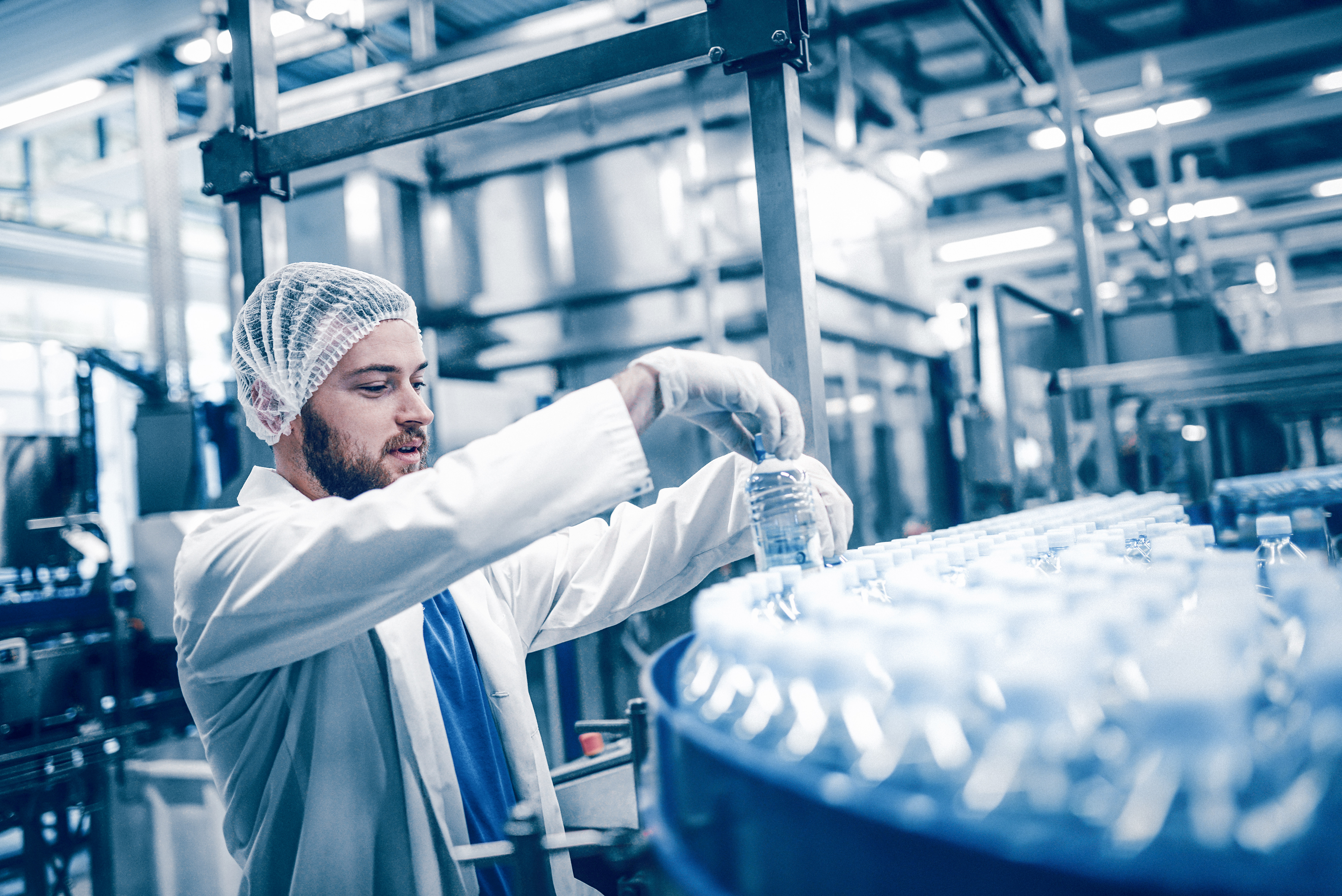 Man placing drinks in a beverage warehouse