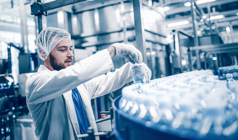 Man placing drinks in a beverage warehouse