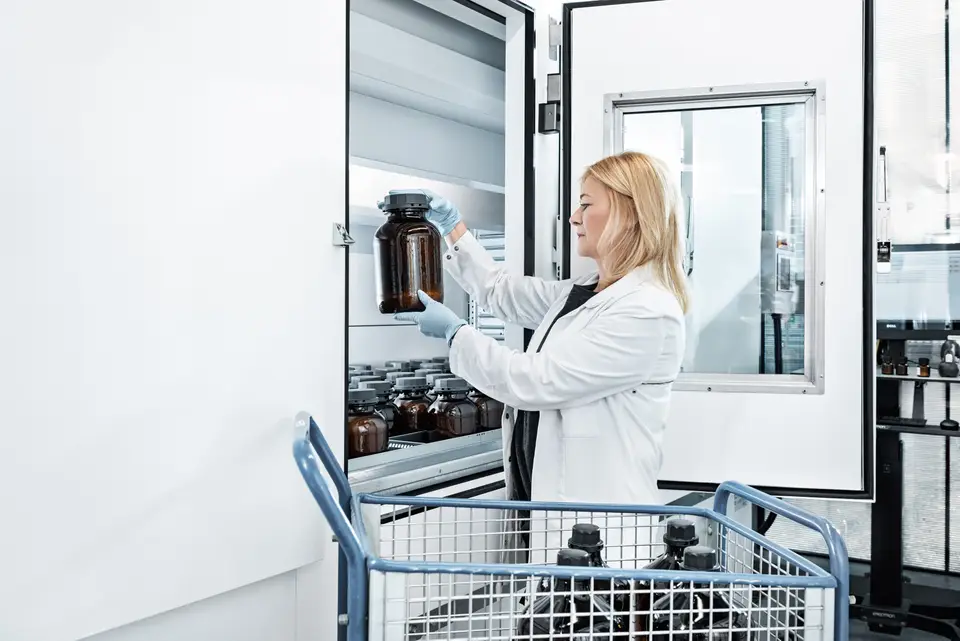 A woman works on a Vertical Lift Module with drying technology 