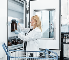 A woman works on a Vertical Lift Module with drying technology 