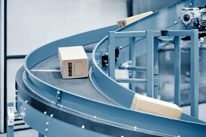 Cartons with customer orders on a conveyor 
