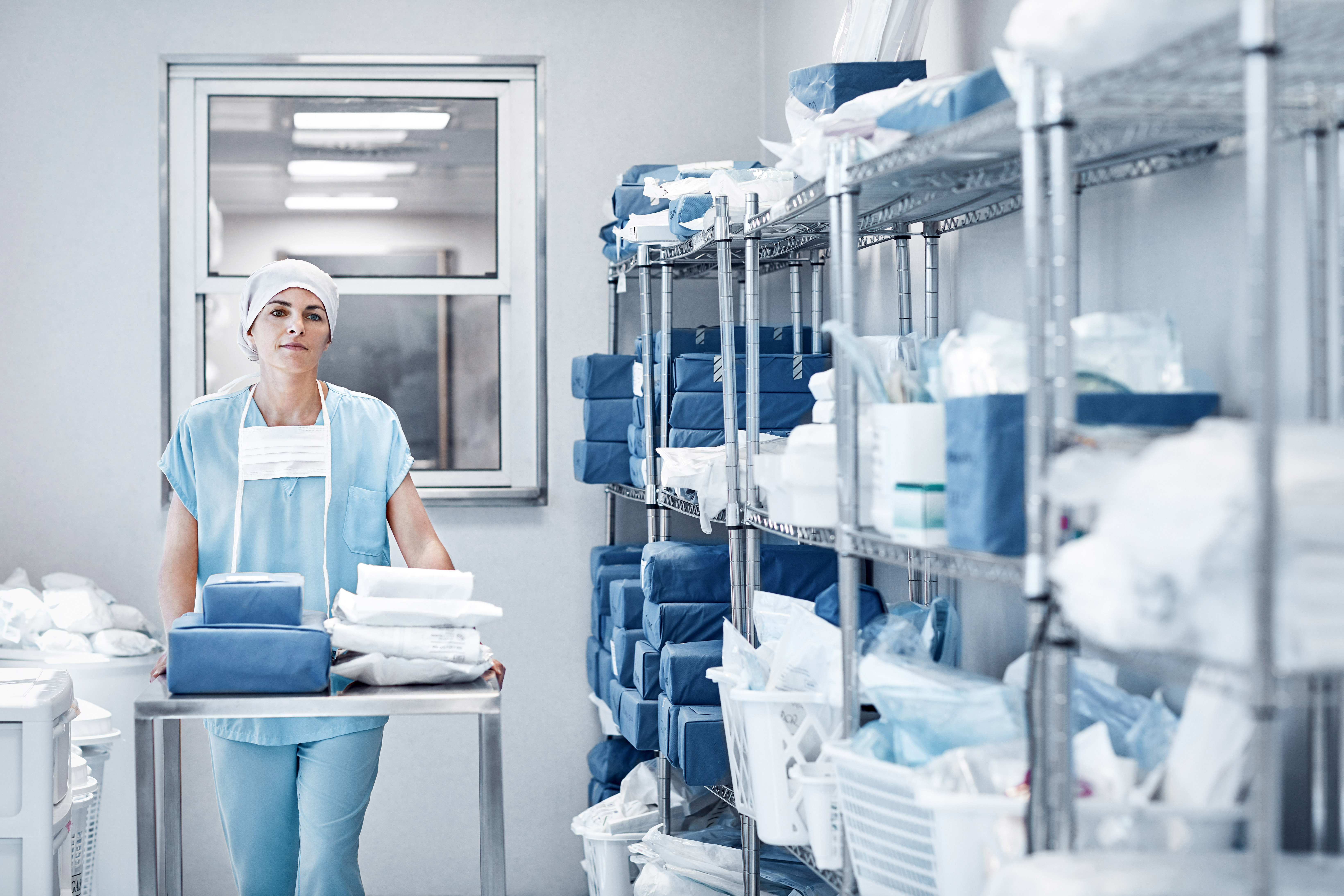 Woman picking clothing in a hospital