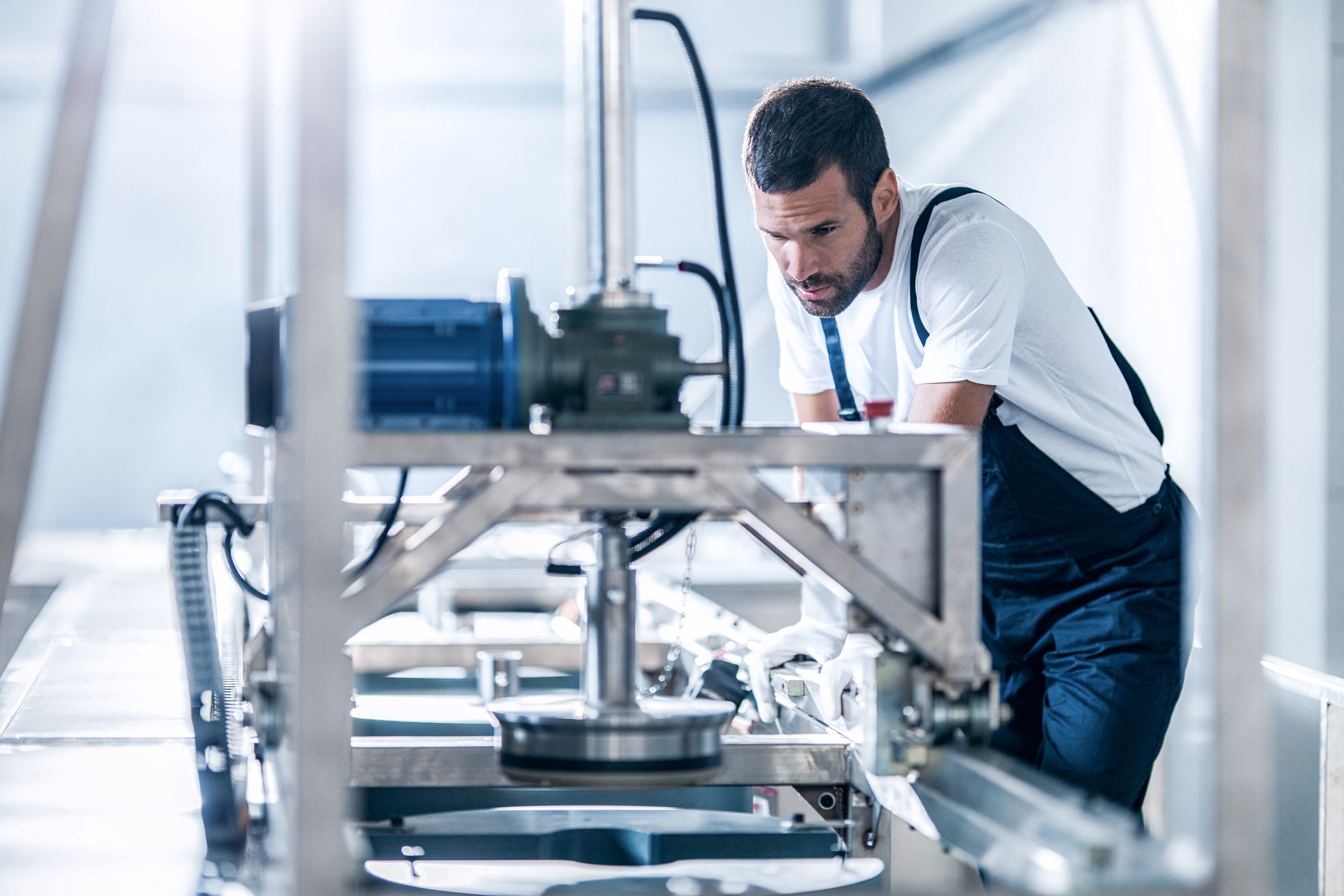 Man working on a machine in the production area