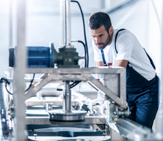 Man working on a machine in the production area