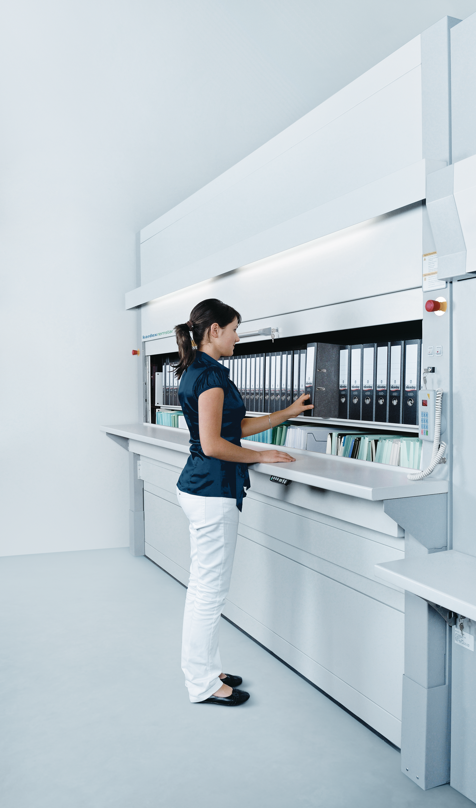 women uses megamat vertical carousel for office filing