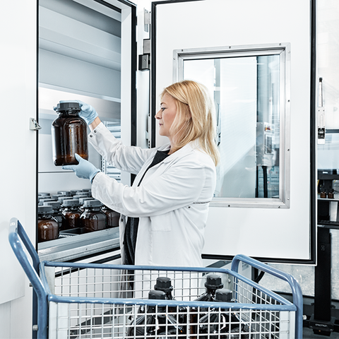 A woman works on a Vertical Lift Module with drying technology 