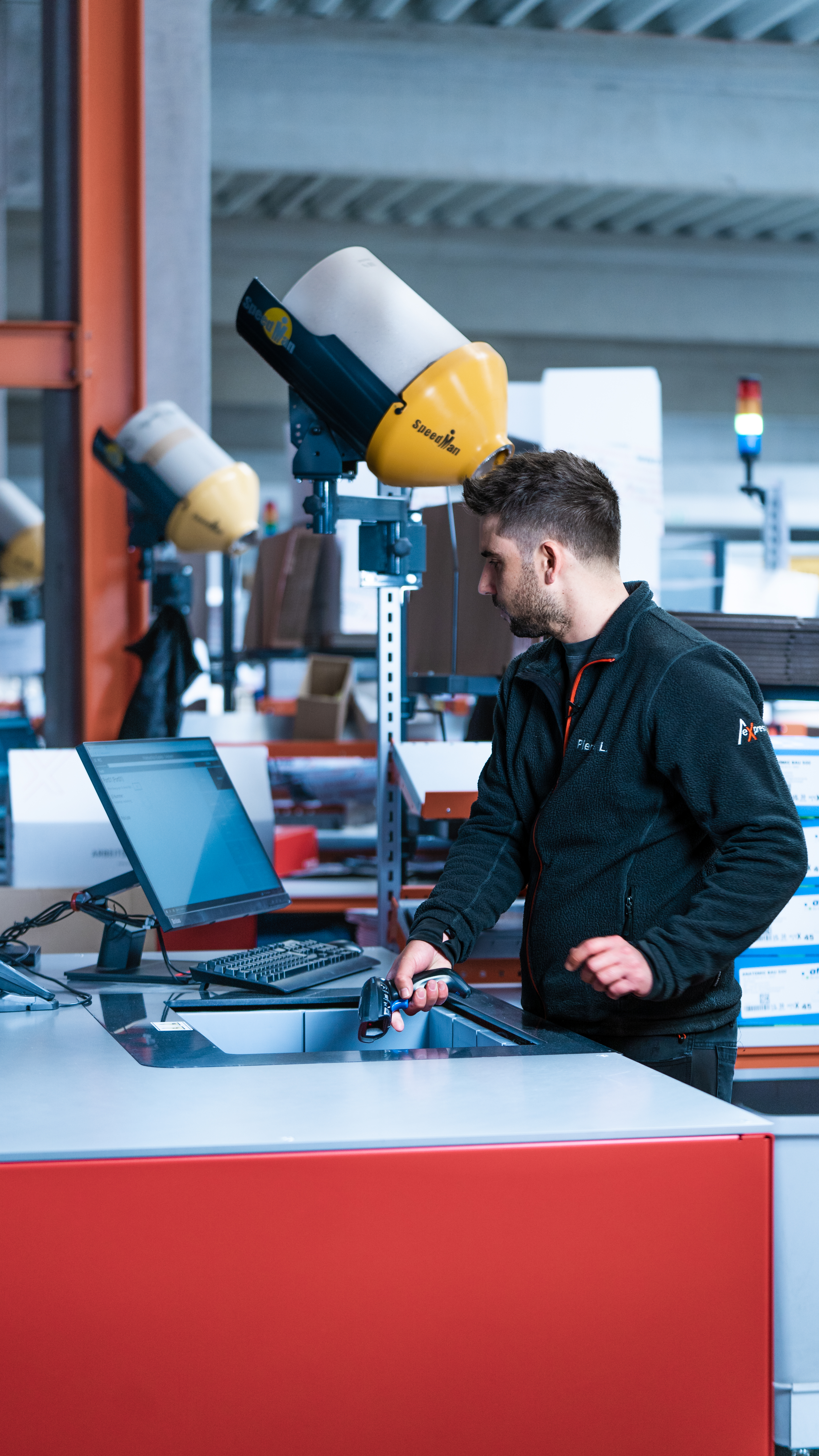 man picking from autostore for pharma production