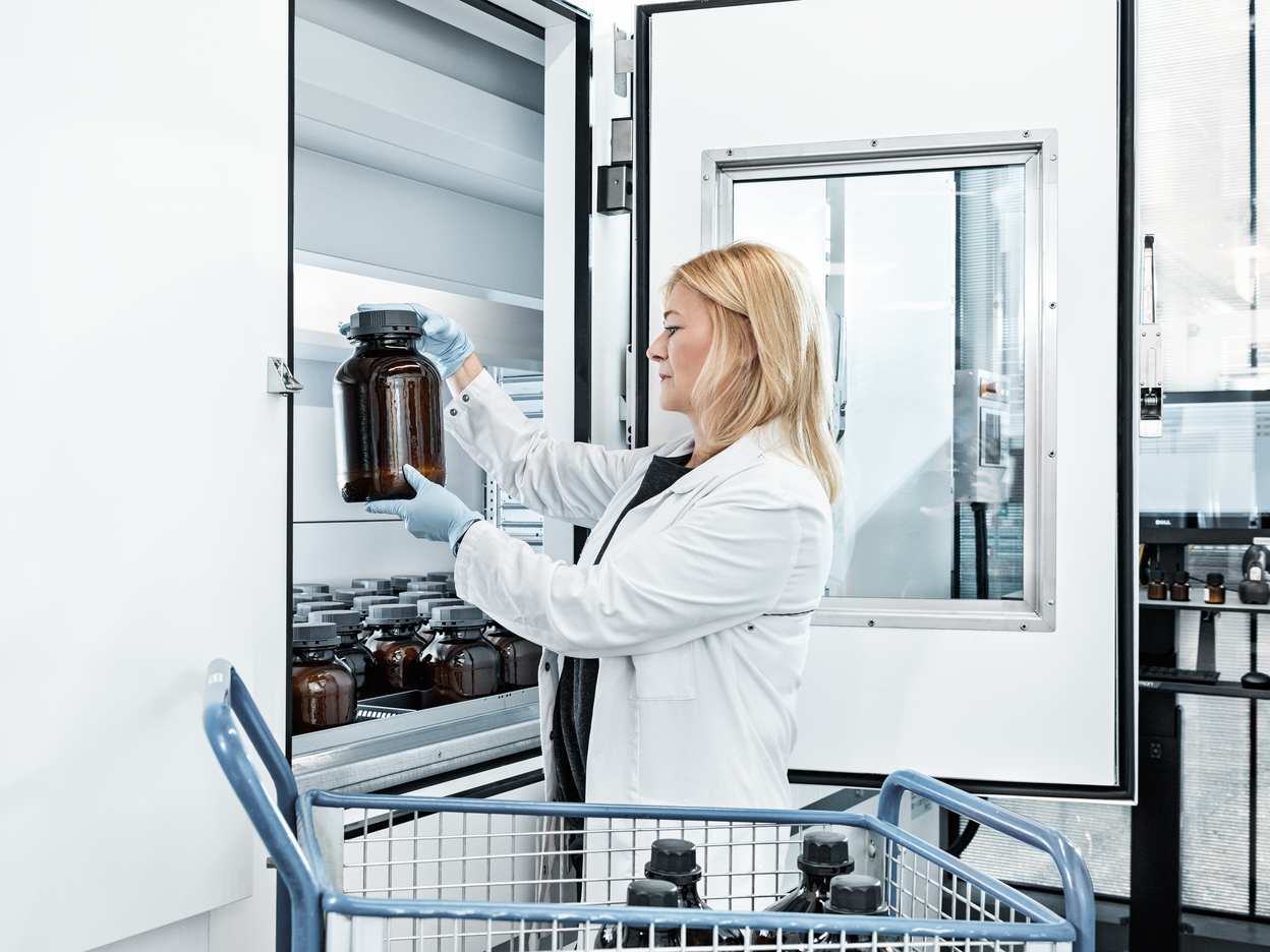 Woman picking clothing in a pharmacy
