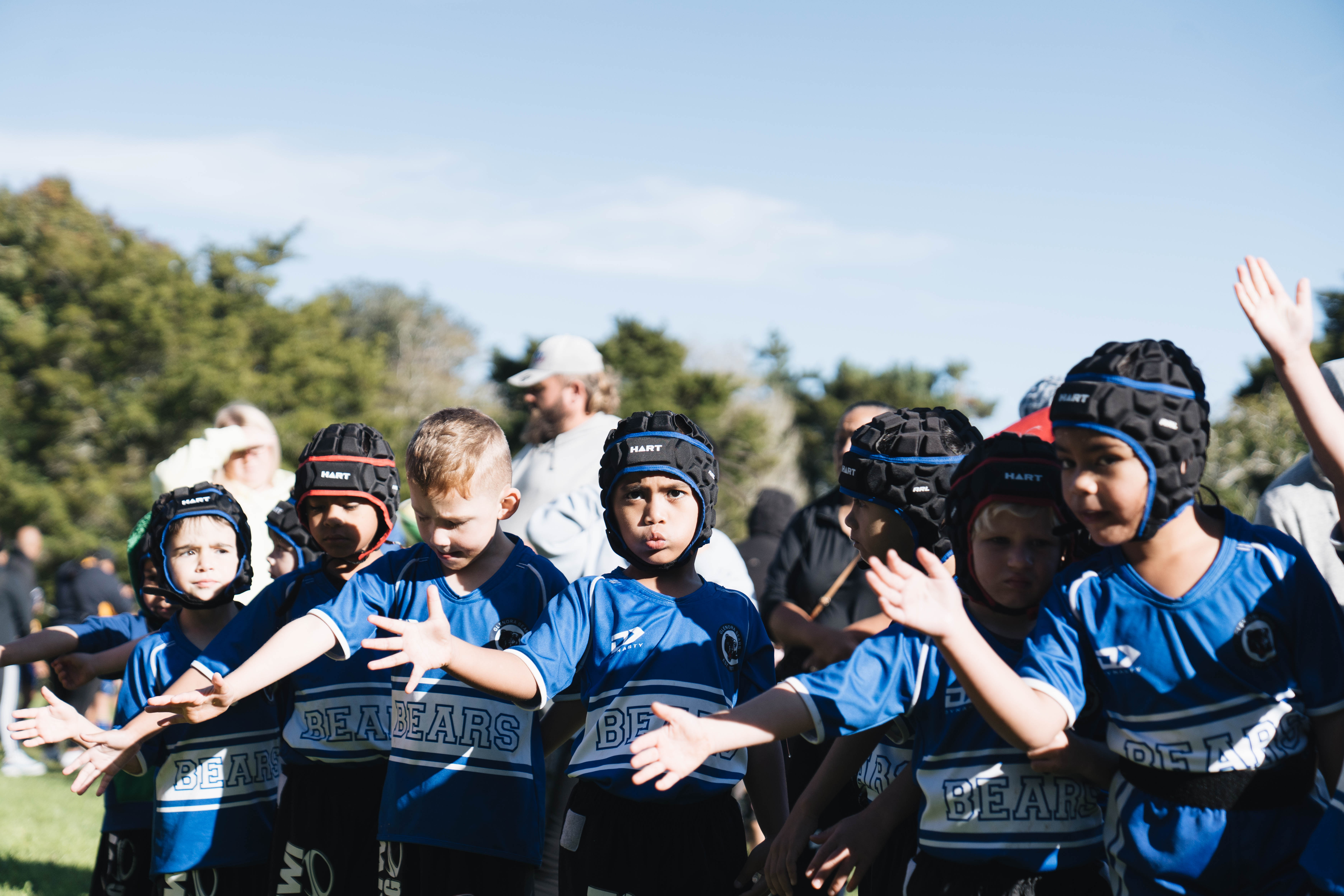 a line of indigenous children ready to participate in sporting event