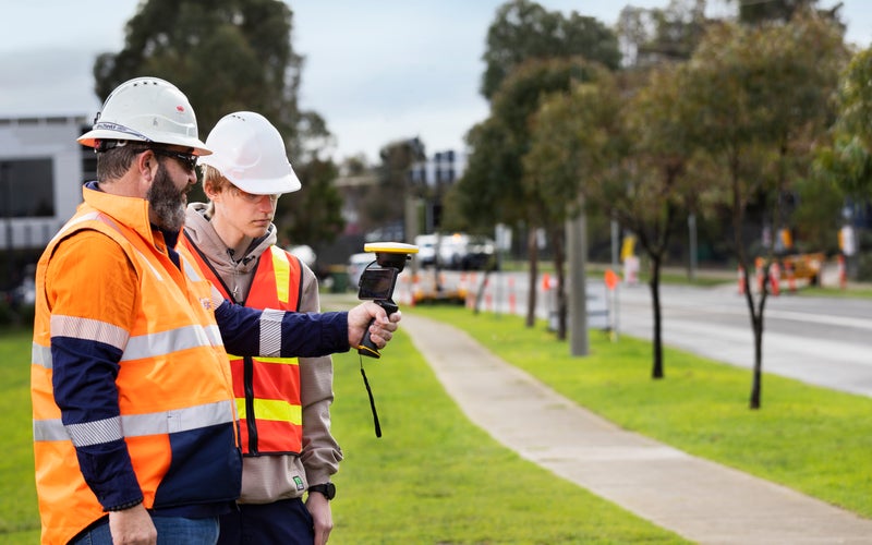 Two men surveying