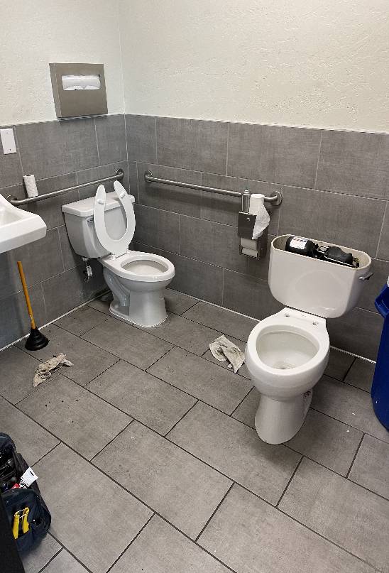 Ongoing toilet repair service in an accessible bathroom of a commercial building