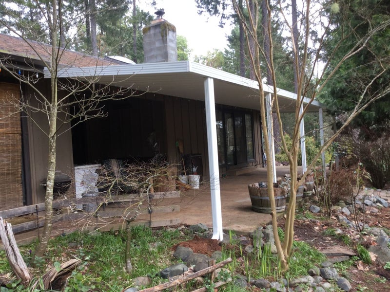 Patio with outdated cover, ready for a modern remodel and fresh design.