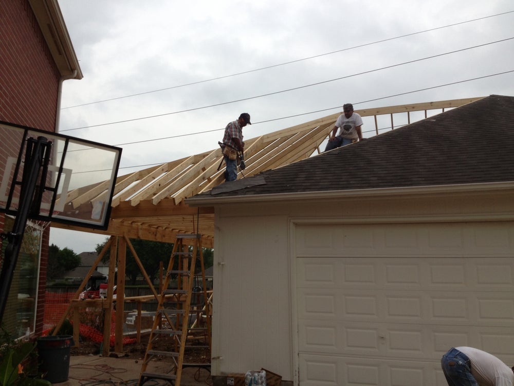 Two working doing outdoor living construction