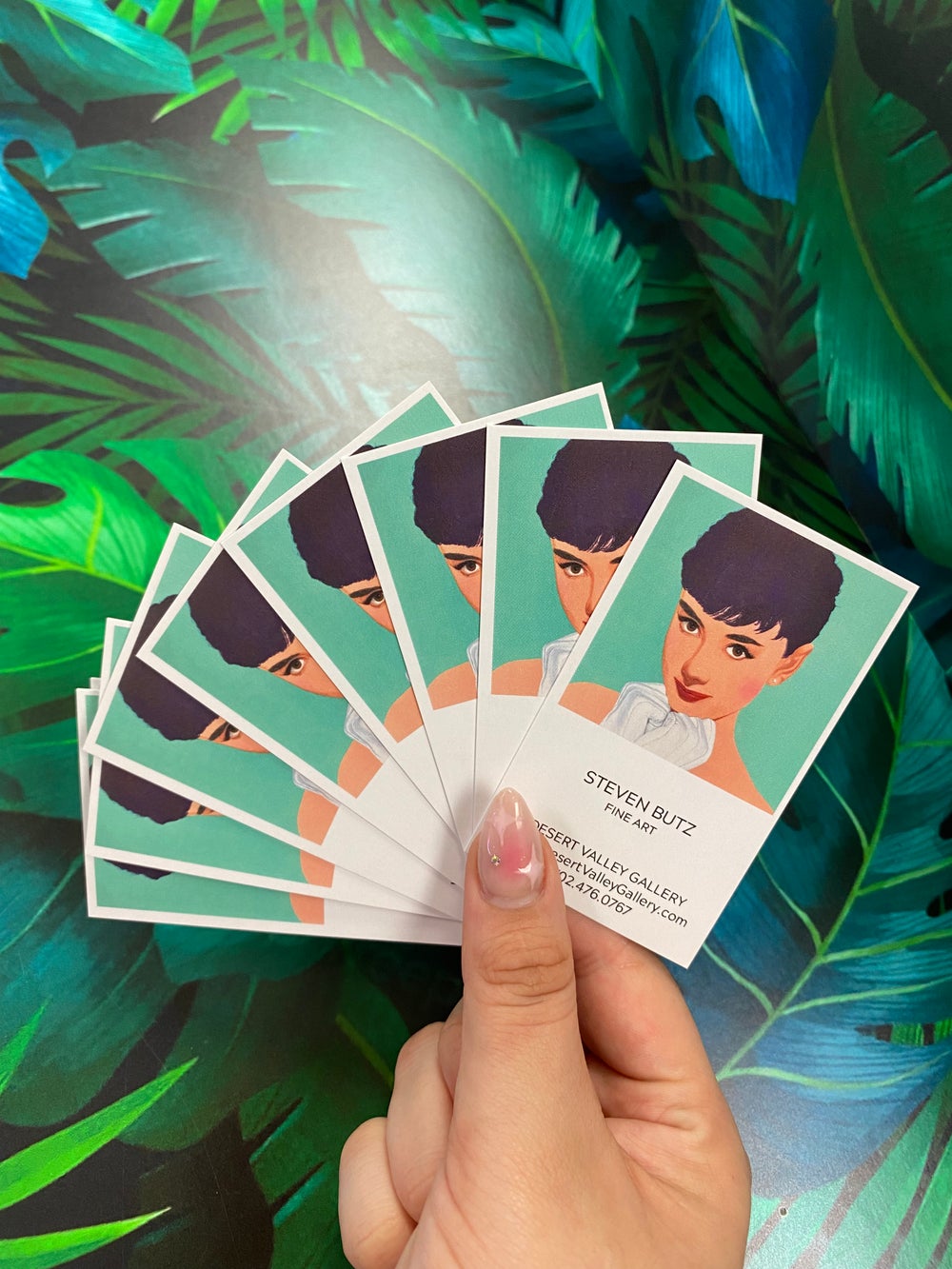 A satisfied customer holding high-quality printed business cards in New York