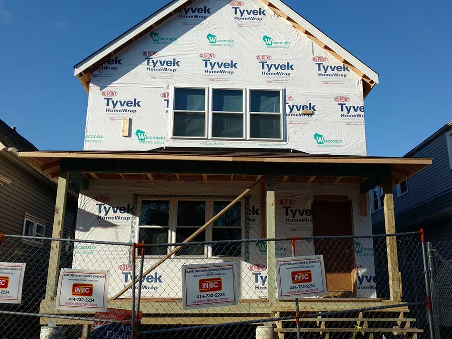 A house in Milwaukee with insulation installation in progress