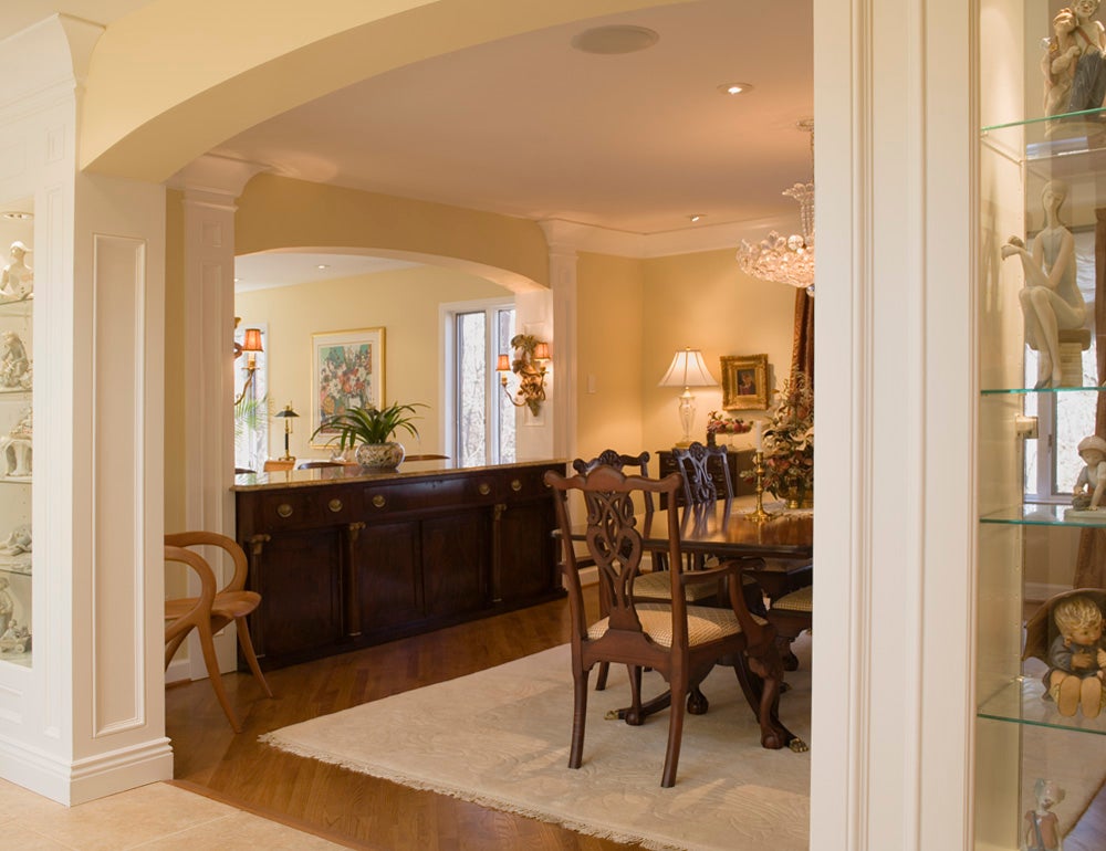 An elegant dining room with classic wooden furniture and decorative accents.