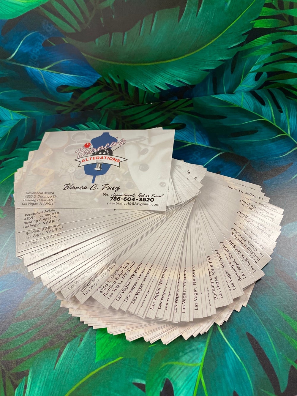 A stack of printed cards showcasing excellent printing services