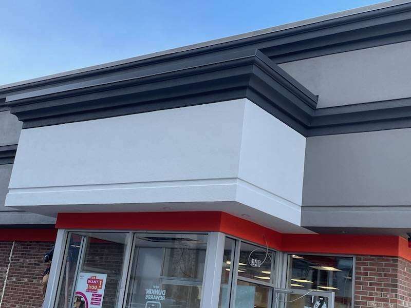 Newly painted and renovated exterior corner of a commercial building.