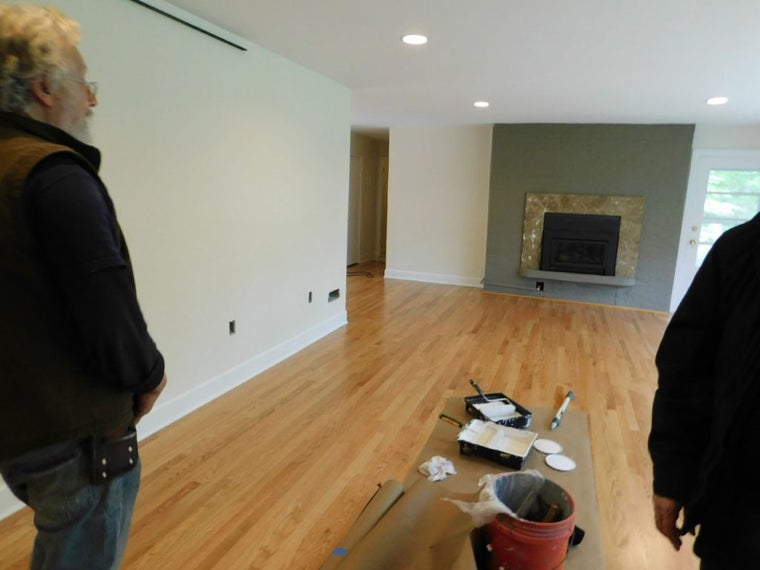 A professional contractor discussing a home improvement project with a homeowner