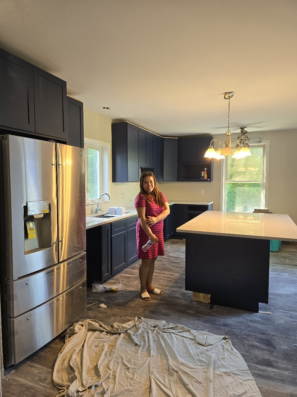 Kitchen renovation in progress, with new cabinets and appliances installed.