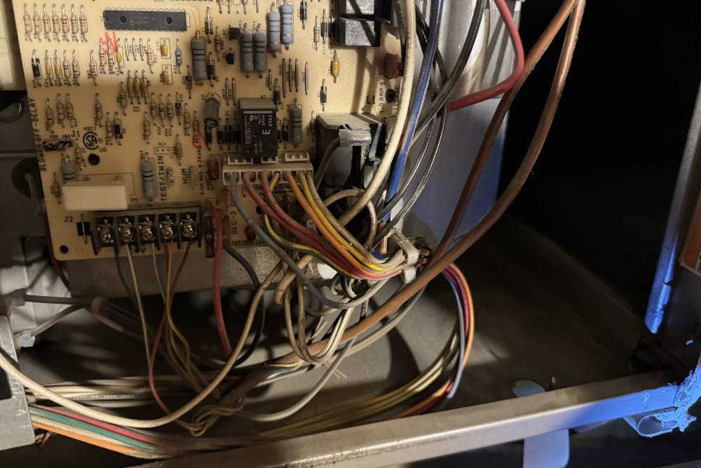 Electronic wiring and circuit board inside a residential HVAC system illustrating control mechanisms