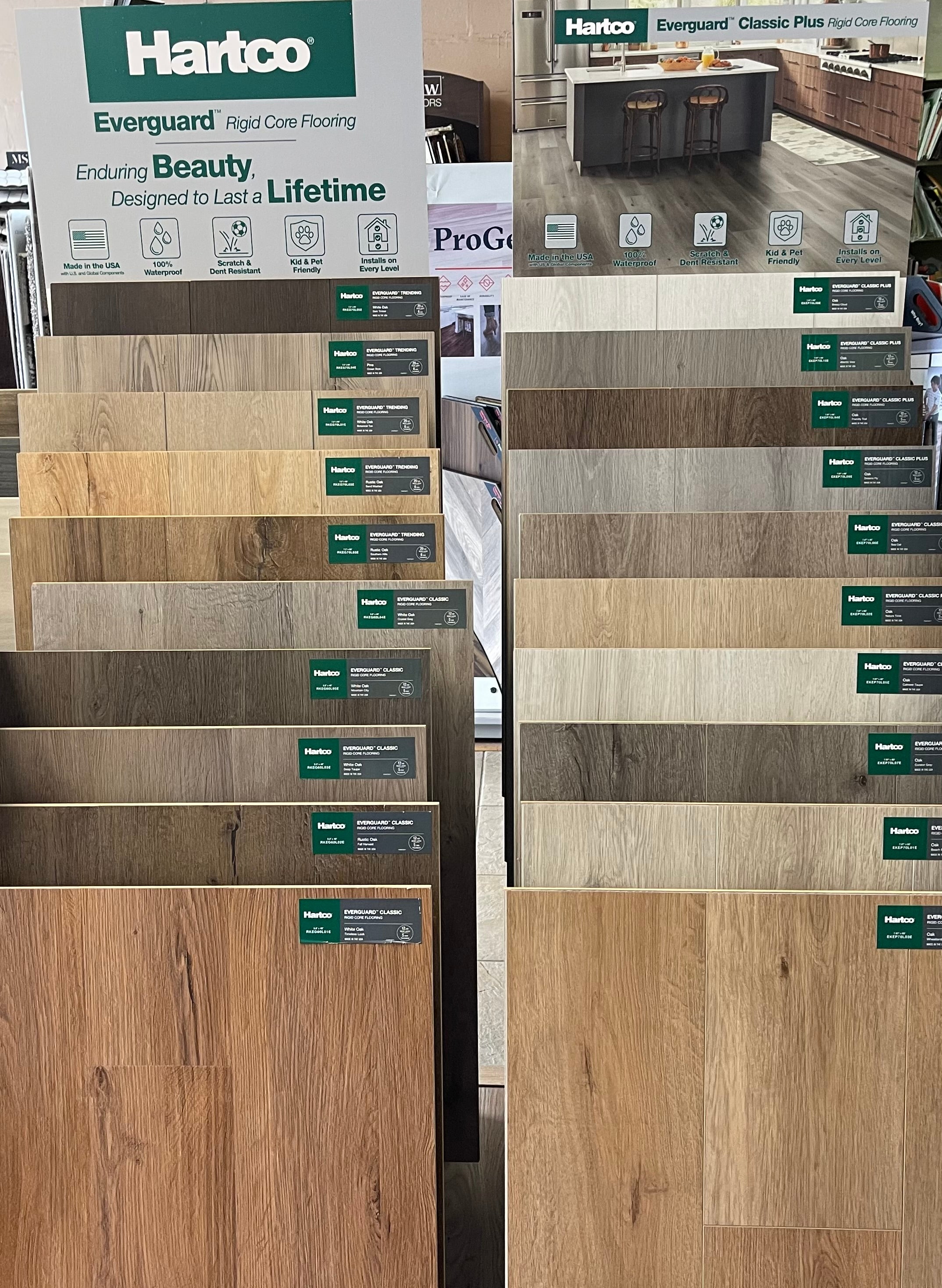 Display rack of Hartco flooring samples featuring various wood and laminate styles and colors