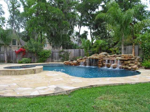 A stunning aerial view of a completed pool installation, showcasing the beautiful and inviting backyard