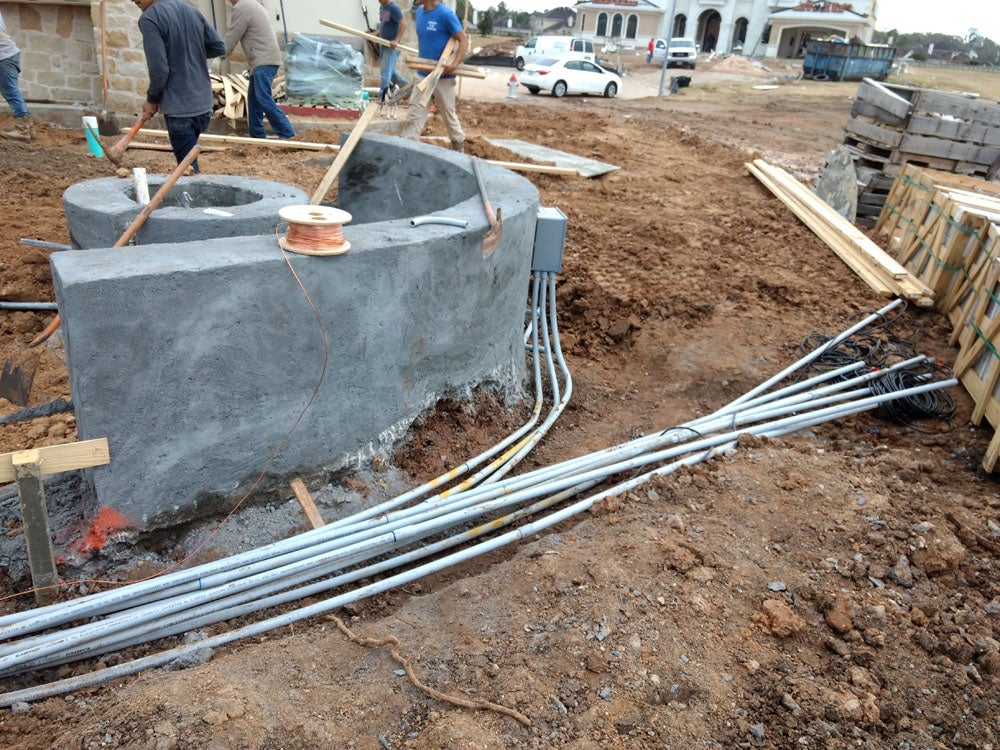 Workers doing pool construction work