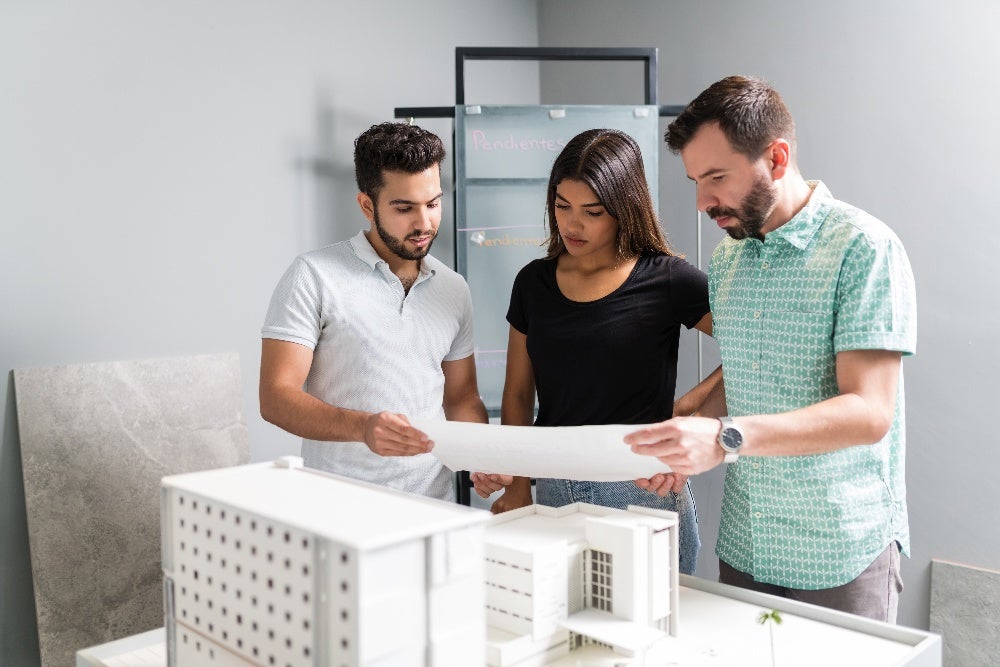 An image showcasing a group of students engaged in a discussion or working together on a project in a local Fort Lauderdale commercial real estate course setting